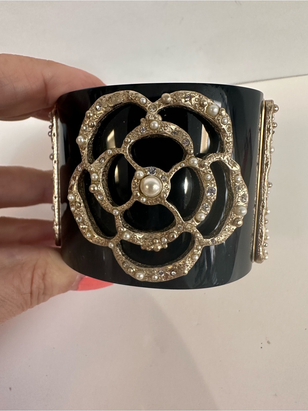 CHANEL Black Resin Cuff Bracelet with Gold-Tone Camellia and Pearls